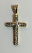 An 18 ct gold diamond set cross (3 grammes total weight)