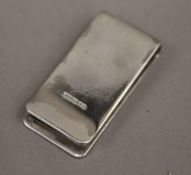 A silver money clip (35 grammes)