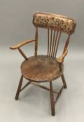 A Victorian elm seated stick back chair