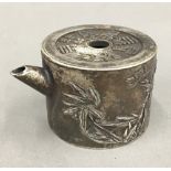 A small Chinese white metal teapot