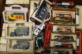 A collection of boxed model cars