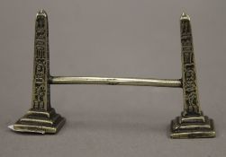 A late 19th/early 20th century knife rest formed as two obelisks