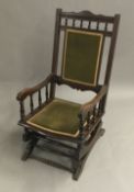 A Victorian upholstered rocking chair