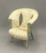 An Art Nouveau upholstered conservatory chair