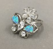 A silver opal and cubic zirconia ring