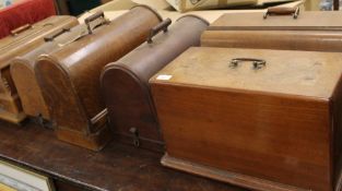 Six various wooden cased Singer sewing machines