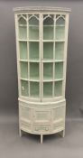 A 19th century painted pine corner cabinet. 184 cm high; 73 cm wide; 51 cm deep.