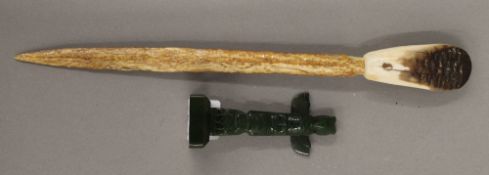 A small Haida American Indian greenstone carving of a totem pole and a 19th century Inuit dagger