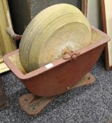 A hand operated grindstone,