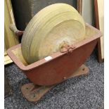 A hand operated grindstone,