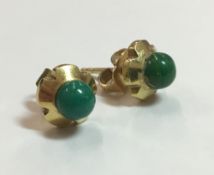 A pair of 18 ct gold jade set stud earrings,