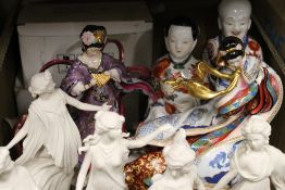 A box of decorative porcelain figures,