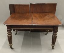 A 19th century mahogany extending dining table.