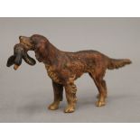 A cold painted bronze retriever with a duck