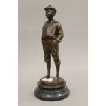 A bronze model of a young boy