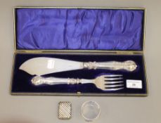 A set of cased silver handled fish servers,