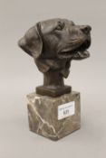 A bronze model of a Labrador mask