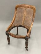 An early 19th century mahogany framed bergere chair