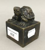 A bronze seal mounted with a tortoise