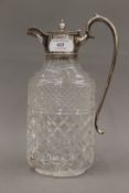 A silver mounted cut glass claret jug