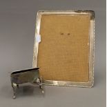 A silver photograph frame and a silver jewellery box