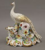 A 19th century Continental porcelain model of a peacock