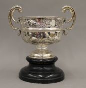 A twin handled embossed silver trophy bowl (13.9 troy ounces).