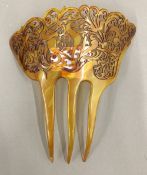 A carved antique blonde tortoiseshell hair comb.