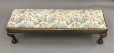 An early 20th century cabriole legged foot stool. 96 cm long, 22 cm deep, 26 cm high.