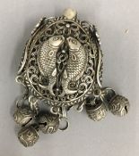 A Chinese white metal fish pendant