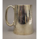 A silver tankard (11.7 troy ounces). 12 cm high.