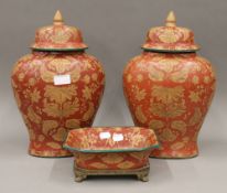 A pair of Oriental style lidded vases,