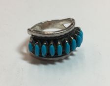 A silver and turquoise ring