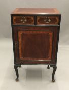 An Edwardian inlaid mahogany side cabinet