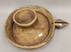 A large tribal wooden bowl and a small elm dairy bowl