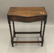 An early 20th century oak barley twist cutlery canteen table (vacant)