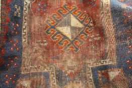 A red and blue ground Caucasian rug