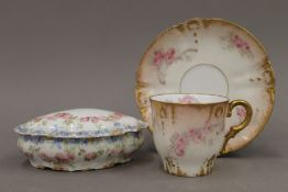 A decorative Limoges ceramic cup and saucer,