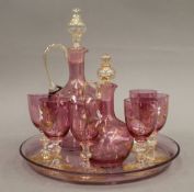 A painted cranberry glass liqueur set