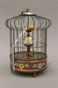 A cloisonne decorated birdcage clock