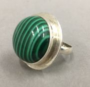 A silver malachite ring