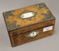 A Victorian brass mounted walnut tea caddy