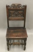 A 19th century carved oak side chair