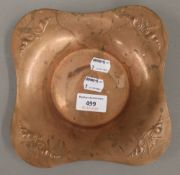 An Arts and Crafts copper dish