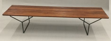 A modern wooden topped tubular framed bench. 183 cm long; 47 cm wide; 39 cm high.