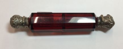 A Victorian cranberry glass double ended scent bottle