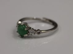 A silver and jade ring