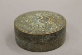 A Chinese bronze round box