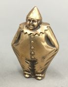 A brass vesta in the form of a clown