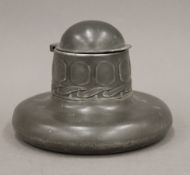 An Arts and Crafts pewter inkwell